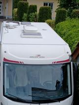 Roller Team Kronos 284 integral mit Hubbett und Einzelbetten - Wohnmobil oder -wagen mit Hubbett