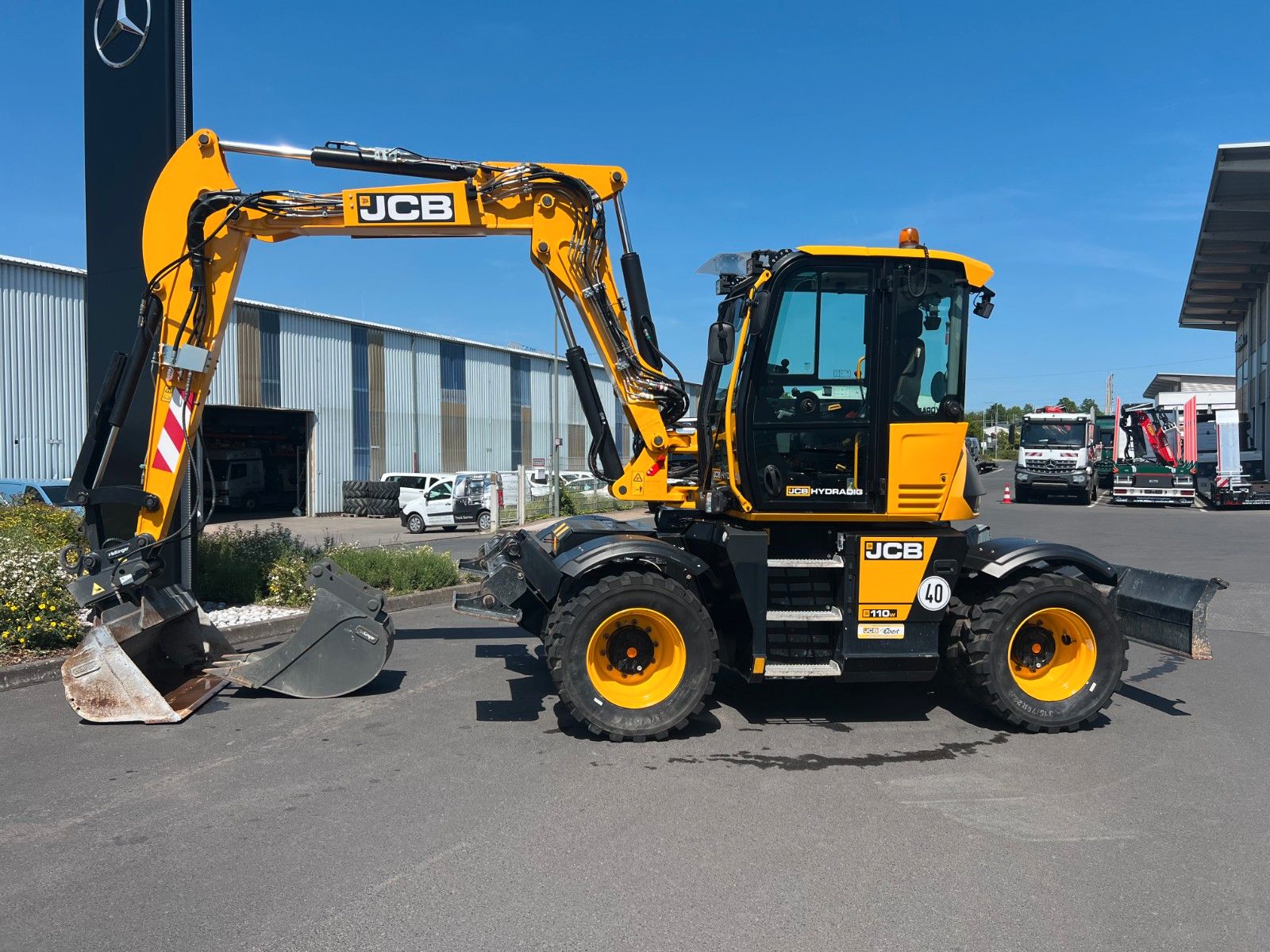 Fahrzeugabbildung JCB Hydradig 110W / Pratzen / nur 179h / Löffelpaket
