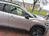 Toyota Corolla Cross 2.0-l-VVT-i Hybrid Teamplayer ... - silberne Toyota Corolla Cross