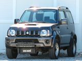 Suzuki Jimny Ranger 4WD 1.3 NAVI/KLIMA/Anhängerk.1 HAND - Suzuki Jimny aus 2012