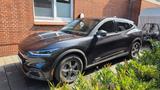 Ford Mustang Mach E   - graue Ford Mustang Mach-E