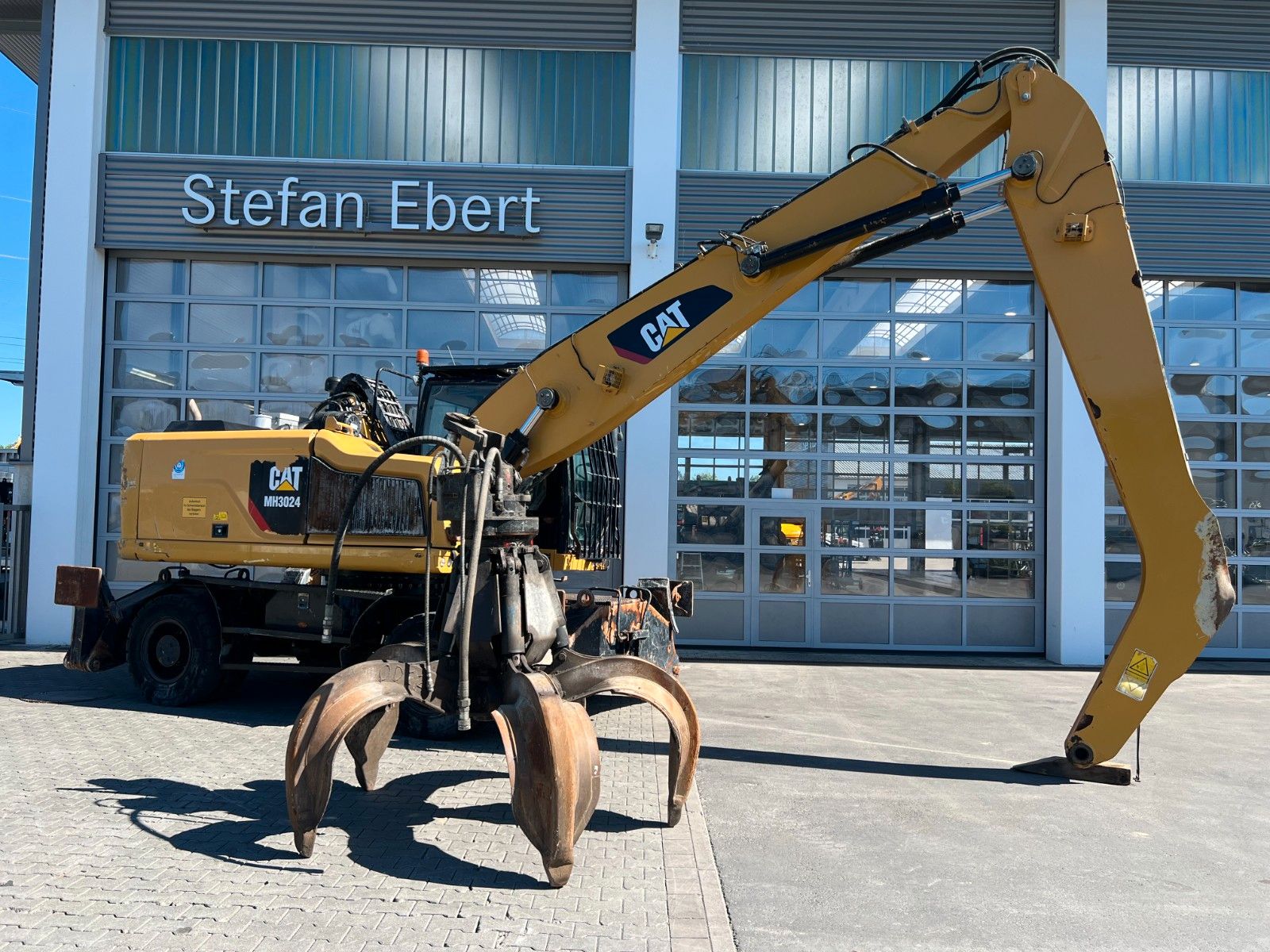 Fahrzeugabbildung CAT MH3024 / Schrottgreifer / 2019 / 9.082h