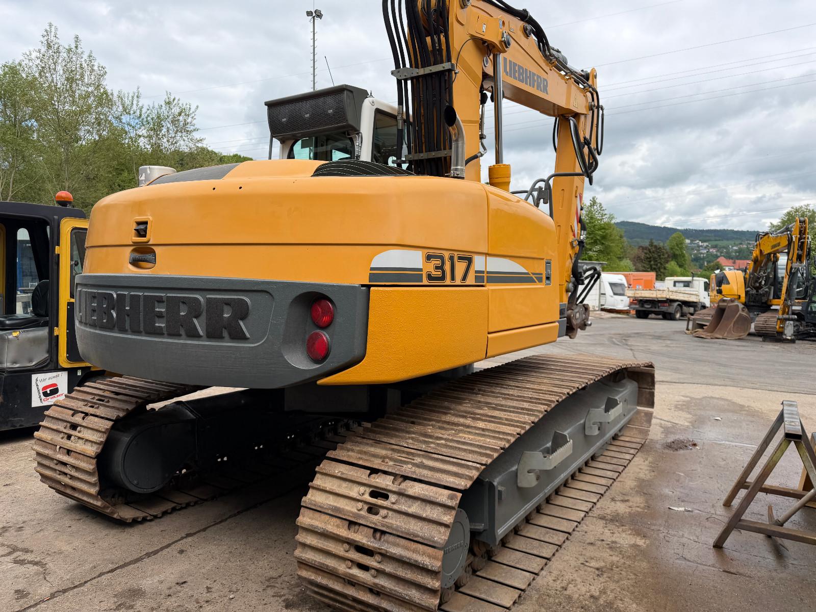Liebherr R 317 Likufix SW 48 3x Löffel