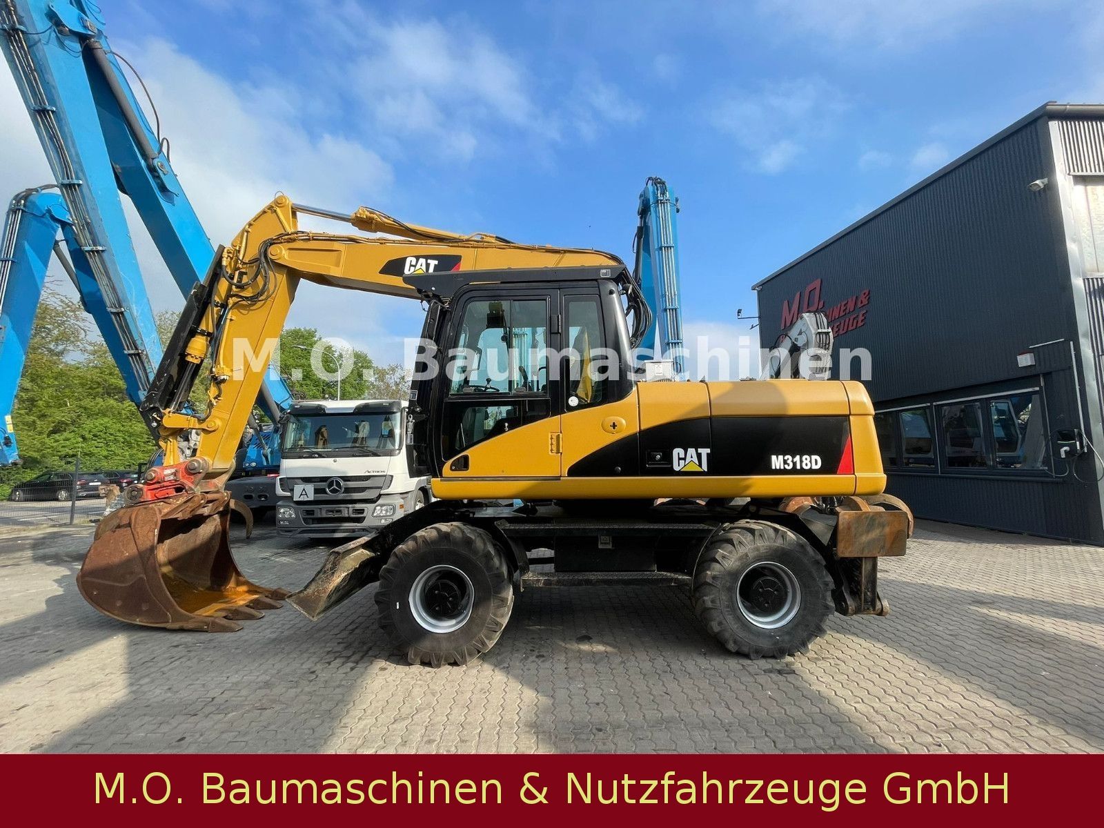 Fahrzeugabbildung CAT M 318 D  / SW /Hammerline + Hammer/ VSA / AC /