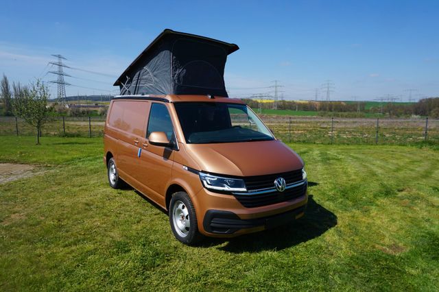 Volkswagen Transporter mit Aufstelldach + Bett