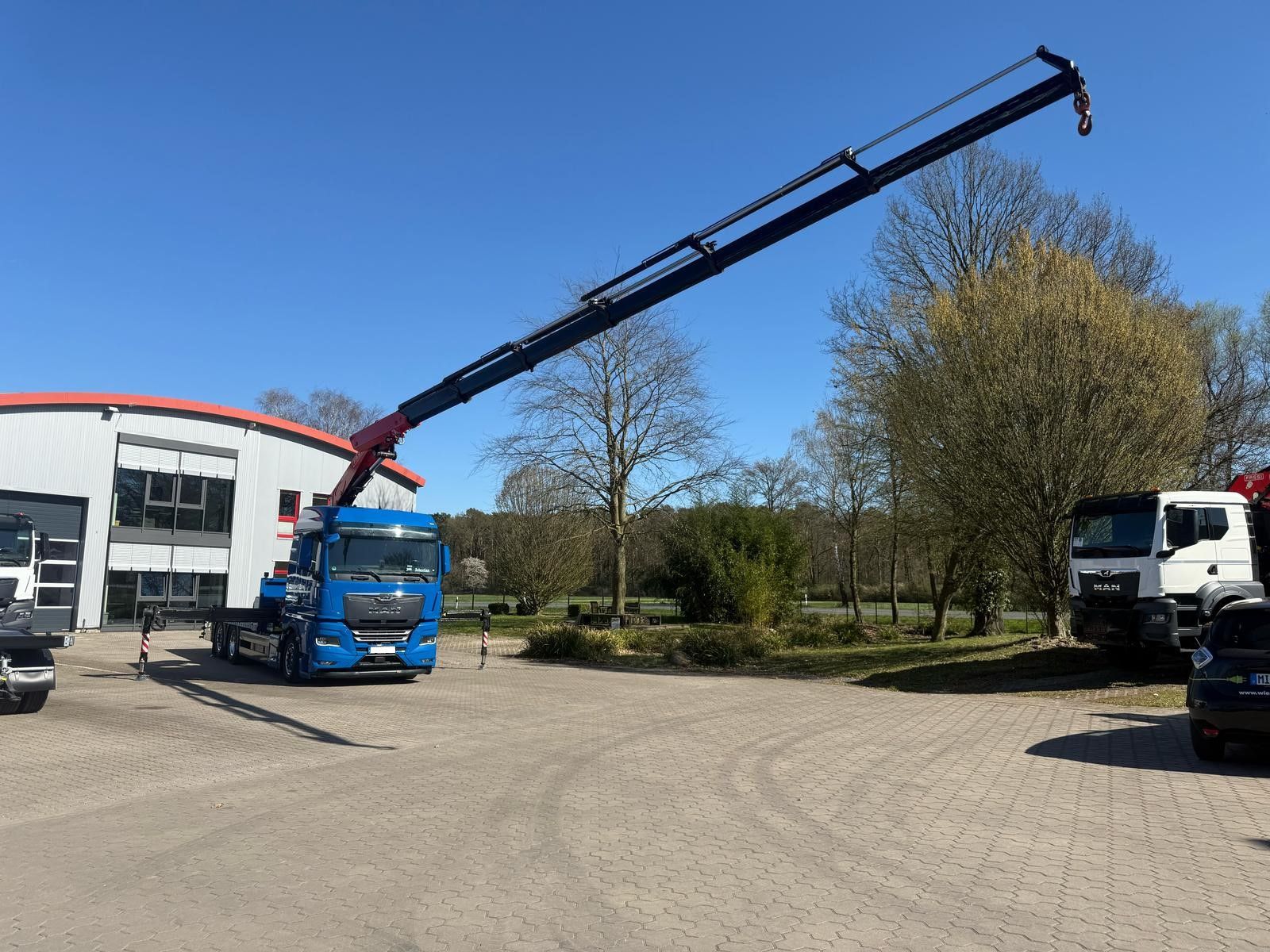 Fahrzeugabbildung MAN TGX 26.640 mit Fassi F365A2.26 Containerpritsche
