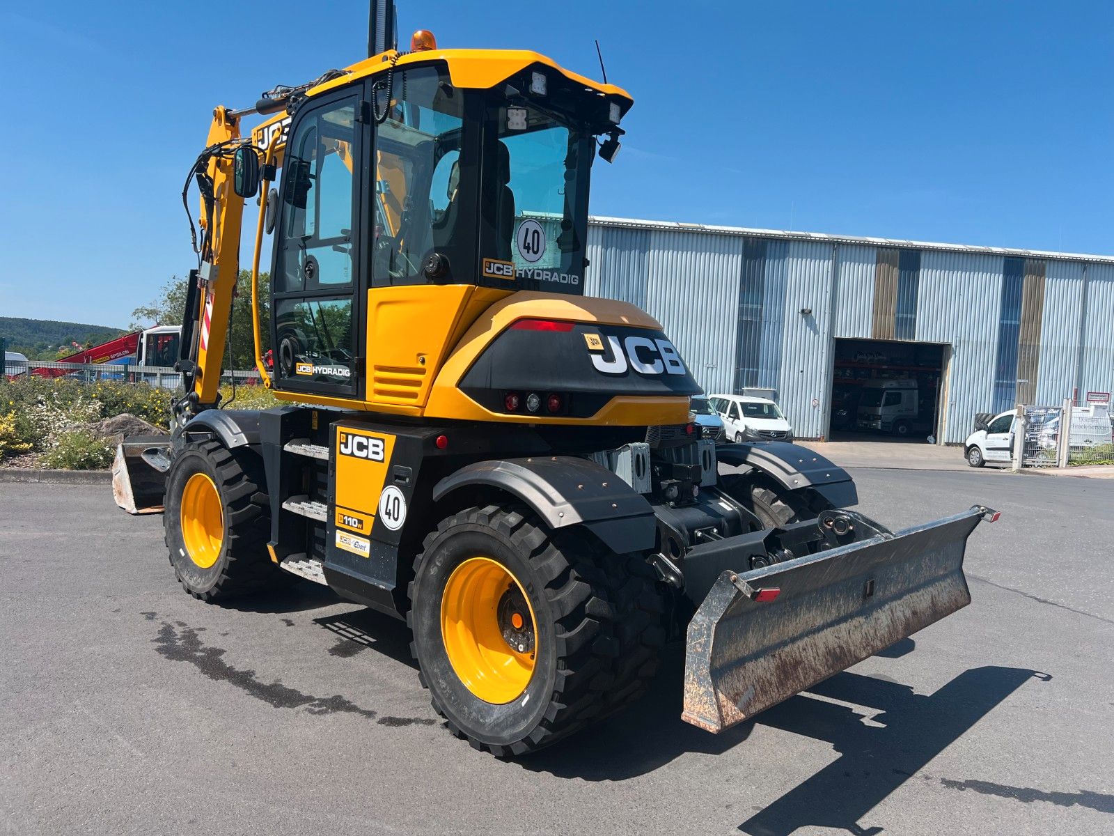 Fahrzeugabbildung JCB Hydradig 110W / Pratzen / nur 179h / Löffelpaket