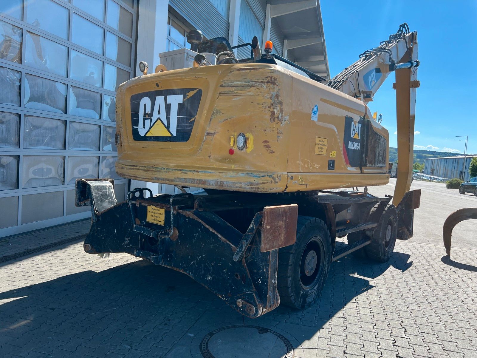 Fahrzeugabbildung CAT MH3024 / Schrottgreifer / 2019 / 9.082h