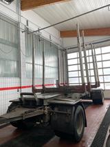 Huttner Holztransporter mit Rungen , Alufelgen - Huttner LKWs