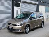 Volkswagen *Garantie*Bi-Xenon*Kurvenlicht*8-fach bereift* - gebrauchte VW Touran aus dem Jahr 2012