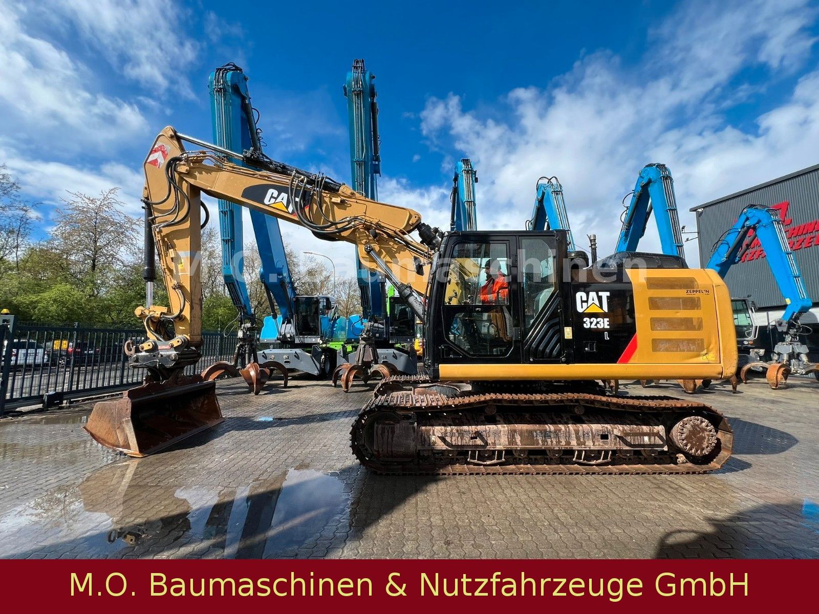 Fahrzeugabbildung CAT 323 EL /Trimble 3 D  VSA / Oilquick OQ 70/55