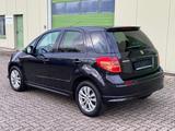 Suzuki SX4 City+ 1.6 Club/Navi./Alu/Klimaaut./SHZG - schwarze Suzuki SX4