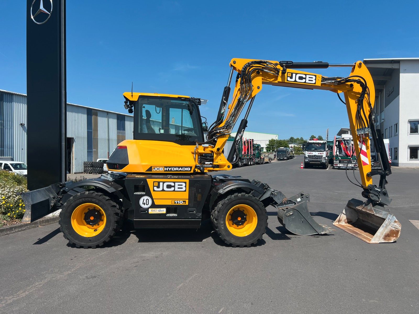 Fahrzeugabbildung JCB Hydradig 110W / Pratzen / nur 179h / Löffelpaket