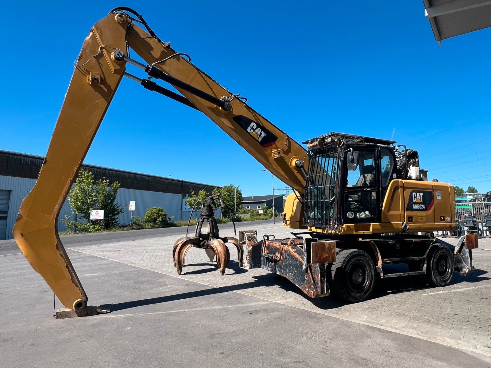 Fahrzeugabbildung CAT MH3024 / Schrottgreifer / 2019 / 9.082h