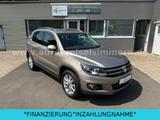 Volkswagen TIGUAN°SPORT&STYLE°NAVI°AHK°GRA°ALU°PDC°ASSIST° - mit Benzin-Antrieb: Beige, Alcantara