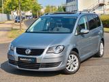 Volkswagen Touran Freestyle BlueMotion*7-Sitz*Navi*Xenon* - gebrauchte VW Touran aus dem Jahr 2009