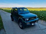 Suzuki Jimny Ranger 1.3 Allrad grün metallic - Suzuki Jimny Gebrauchtwagen in Stuttgart