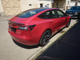 Tesla Model 3 Performance TÜV auf Wunsch neu - rote Tesla Model 3