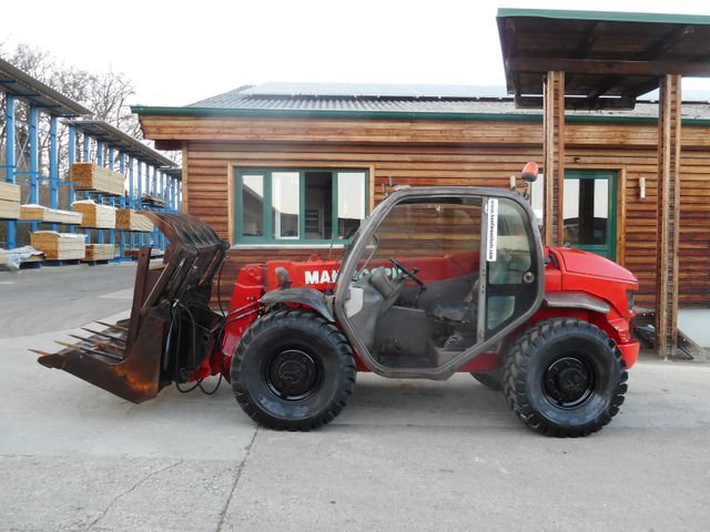 Manitou MT 523 mit Greiferschaufel und Mistgabel