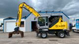Fuchs TeRex MHL 320 D Umschlagbagger Greifer Pratzen