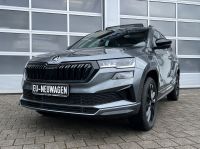 Skoda Karoq 1.5 TSI DSG Sportline PANO KAM AHK 4JGAR bei Autohaus Landmann & Maier OHG