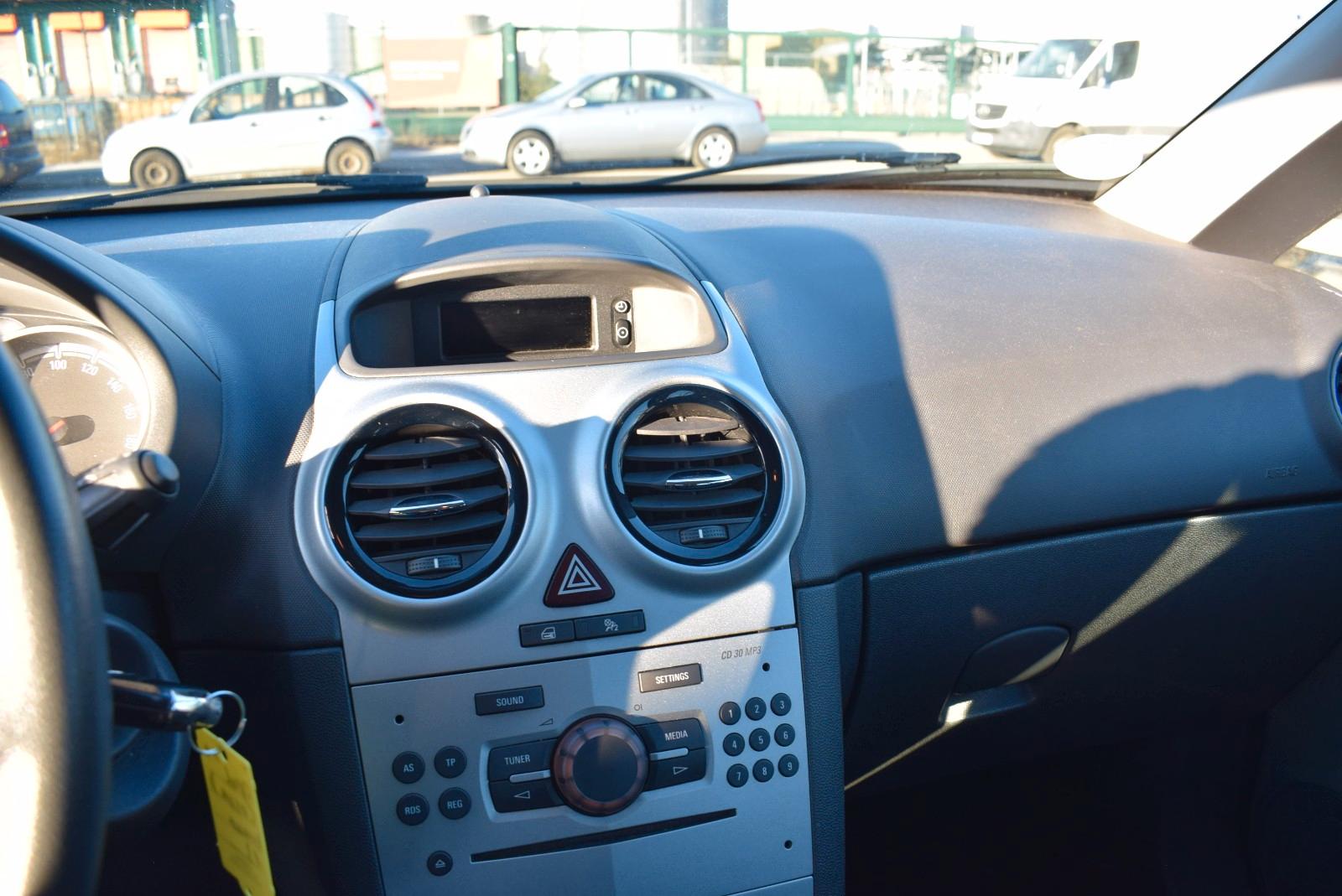 Opel Corsa 2013 — photo 14
