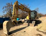 CAT M318C - CAT Mobilbagger 318