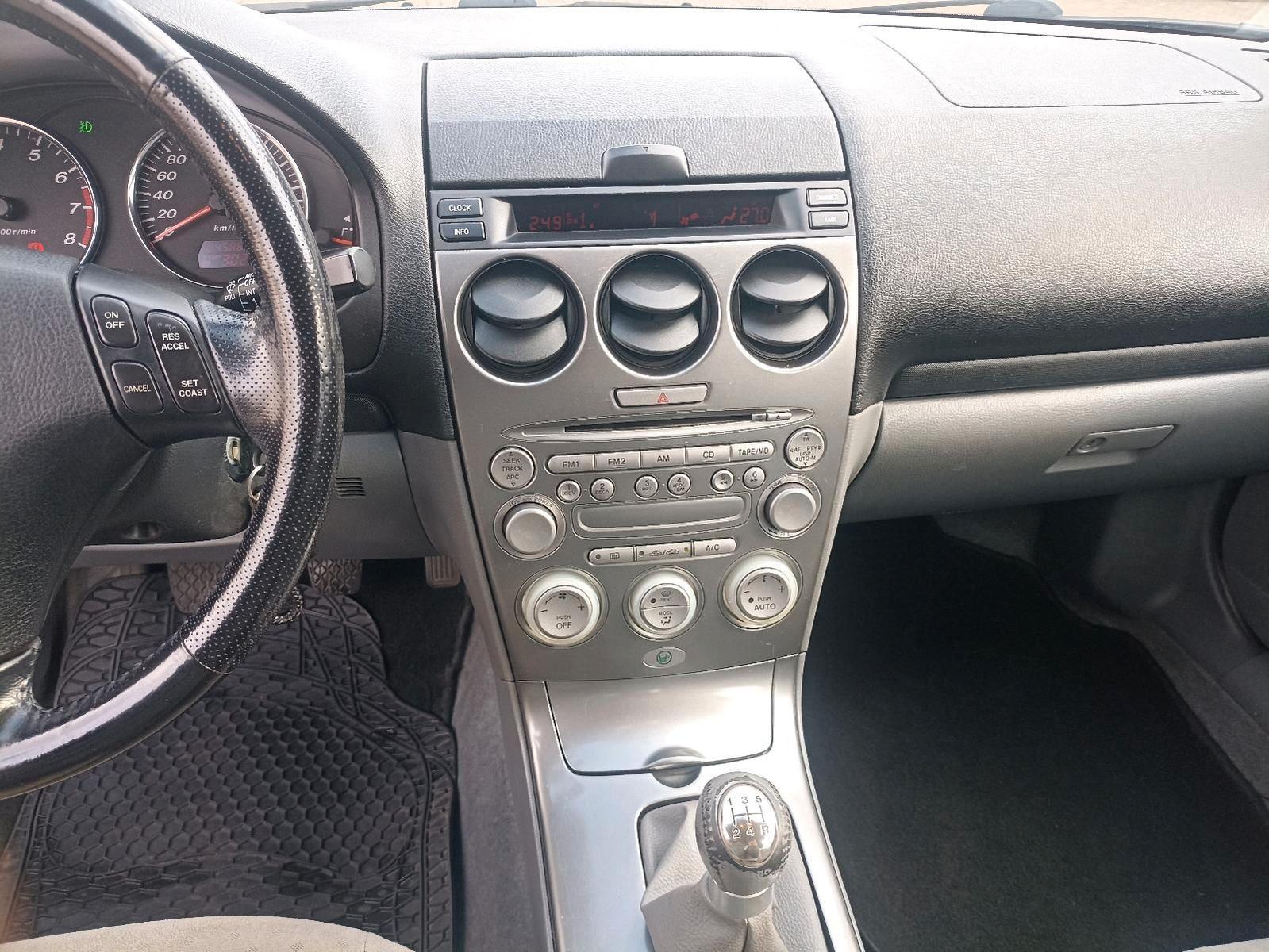 Mazda 2 2004 — photo 11