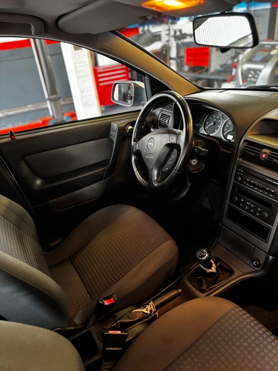 Opel Astra 2004 — photo 11