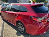 Toyota Corolla 1,8 Hybrid Team Deutschl Touring Spo... - gebrauchte Toyota Corolla aus dem Jahr 2022