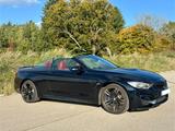 BMW M4 Cabrio Deutsch - schwarze BMW M4