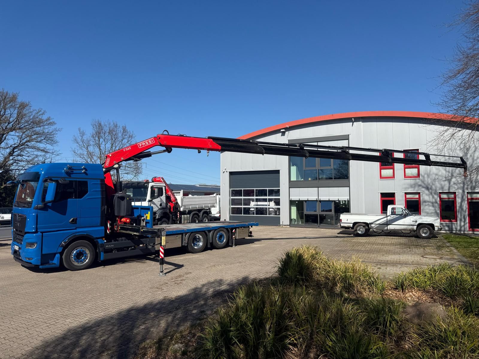 Fahrzeugabbildung MAN TGX 26.640 mit Fassi F365A2.26 Containerpritsche