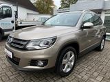 Volkswagen Tiguan Sport 1.4 TSI DSG+Bi-Xenon+Tem+Kam+SiHe - mit Benzin-Antrieb: Beige, Geländewagen, mit Klimaautomatik
