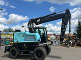 CAT M317 F mit OilQuick OQ 70/55 - CAT Radlader