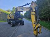 CAT M 318 D  Bio-Öl - Unfallschaden - CAT Mobilbagger 318