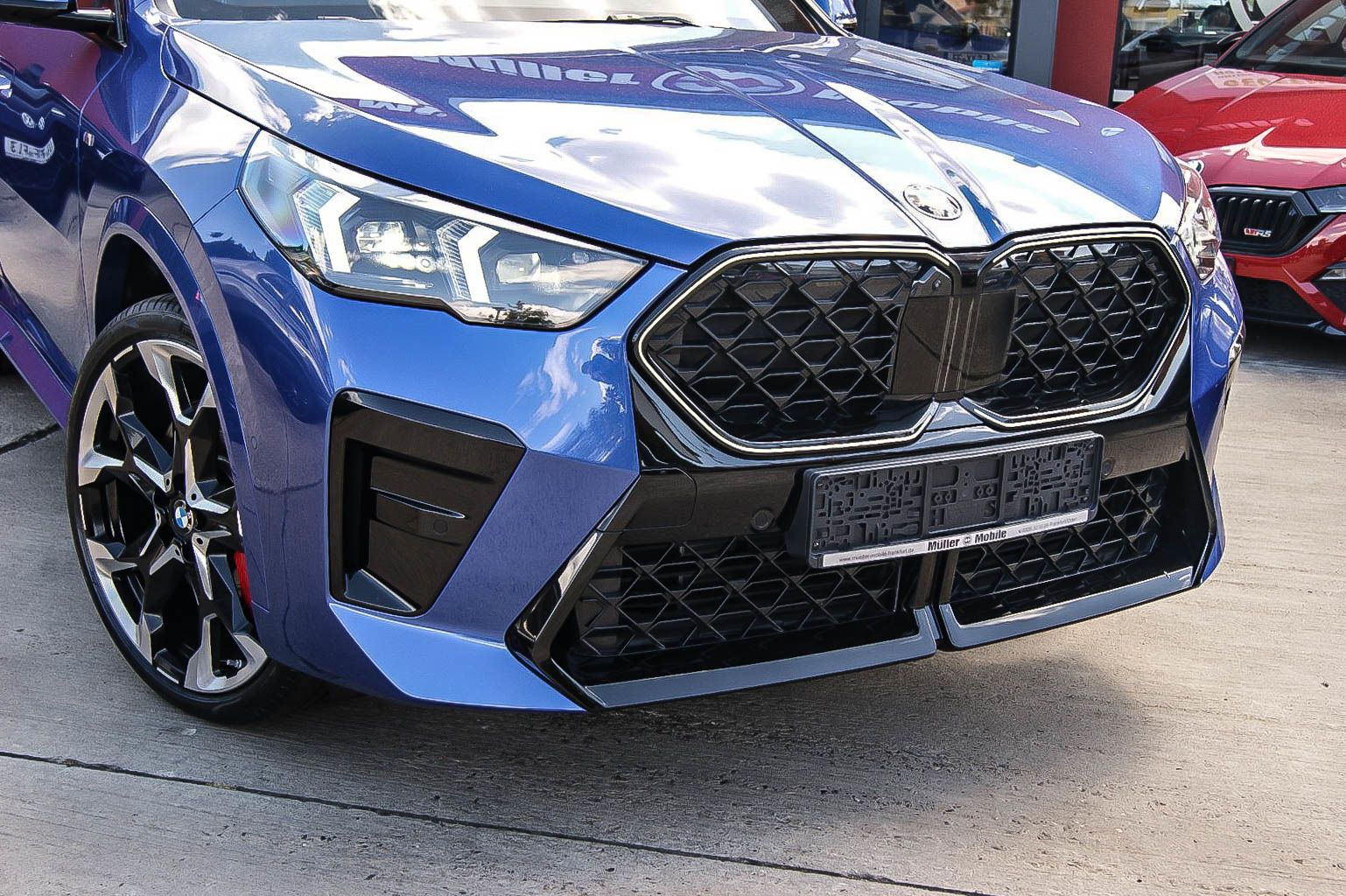 BMW X2 20 i sDrive M Sport Pro IconicGlow Coral Rot imagem 2