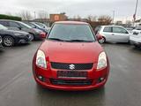 Suzuki Swift Lim. Club - Suzuki Swift mit Benzin-Antrieb: Orange
