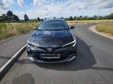Toyota Corolla 1,8 Hybrid Team Deutschl Touring Spo... - Toyota Corolla Gebrauchtwagen in Frankfurt