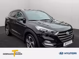 Hyundai Tucson 1,6l Style 8 fach bereift auf LM Felgen - : Schwarz, Felge