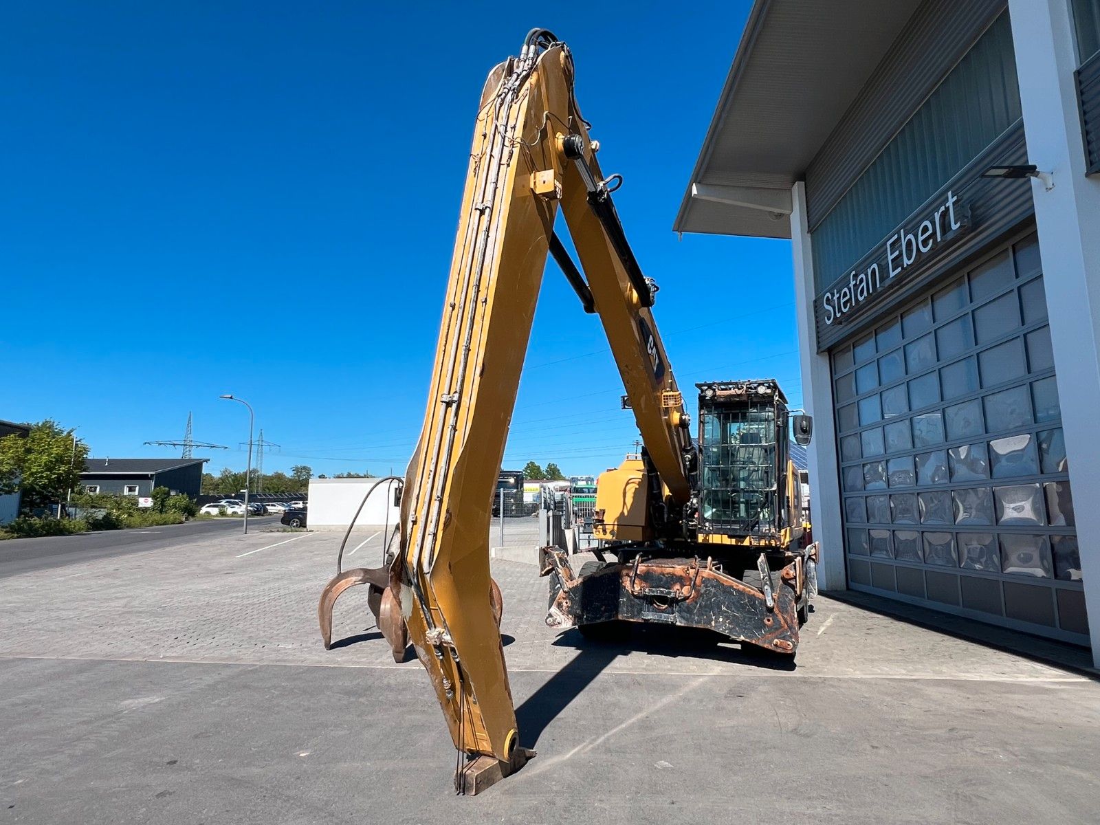 Fahrzeugabbildung CAT MH3024 / Schrottgreifer / 2019 / 9.082h
