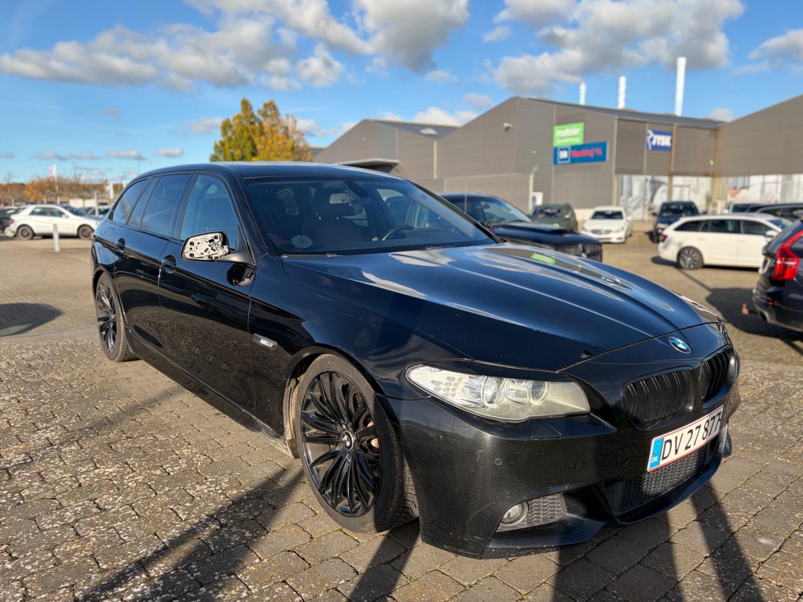 BMW 520 2011 — rear view