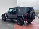Jeep Wrangler Unlimited Sahara*NUR 140TKM*NAVI*BLACK* - Jeep Wrangler in Mainz