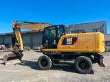 CAT 320 F mit OilQuick 70/55 Rototiltsteuerung - CAT Mobilbagger M320