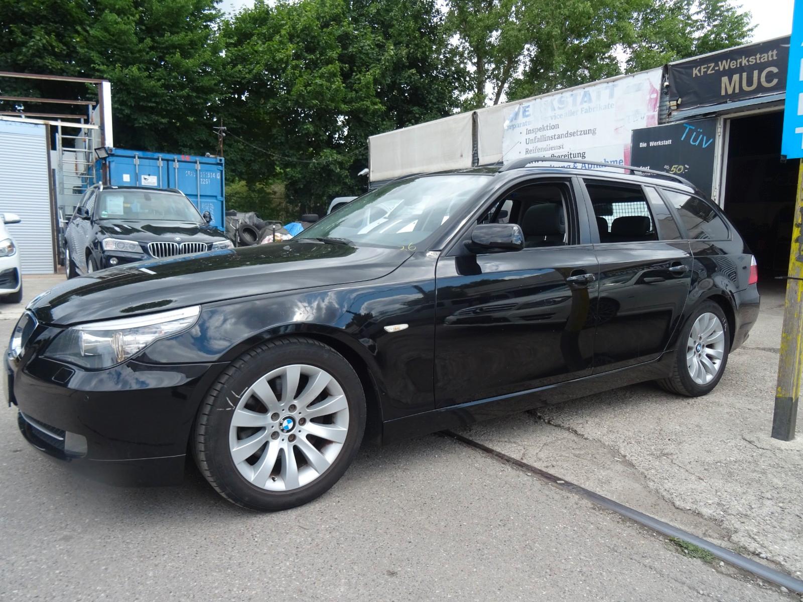 BMW 520 2009 — rear view