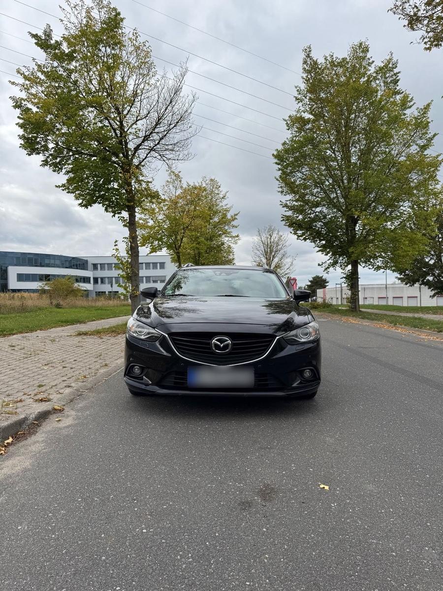 Mazda 2 2014 — вигляд ззаду