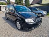 Volkswagen Touran Goal / 1.6 / 7-SITZER / AUTOMATIK / NAVI - Volkswagen Touran mit Benzin-Antrieb: Kleinbus, Automatik, 1.6