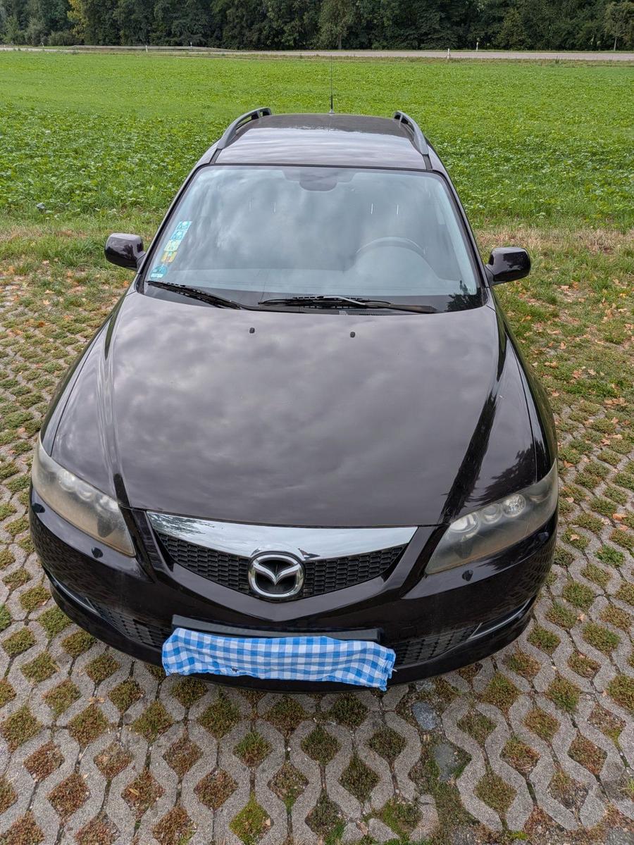 Mazda 2 2007 — вигляд ззаду