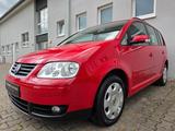 Volkswagen Touran 1.6 FSI AUTOMATIK SHZ NAVI KLIMAAUT. BT - Volkswagen Touran mit Benzin-Antrieb: Kleinbus, Automatik, 1.6