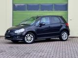 Suzuki SX4 City+ 1.6 Club/Navi./Alu/Klimaaut./SHZG - schwarze Suzuki SX4