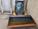 CAT 226D3 Lader mit Schwergutschaufel - CAT D3